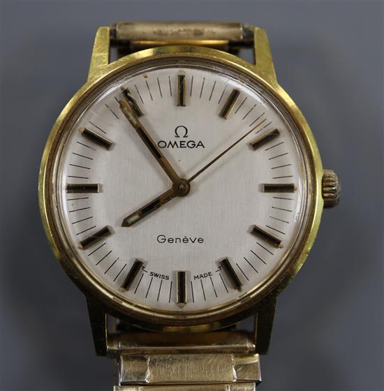 A gentlemans gold plated and steel Omega manual wind wrist watch, on associated flexible strap.